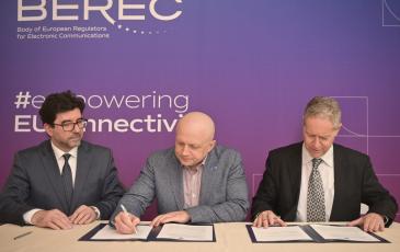 The image shows Laszlo Ignezci (BEREC Office Director), Oleksandr Zhyvotovskyi (NCEC Chairman), and Tonko Obuljen (BEREC Chair 2024)